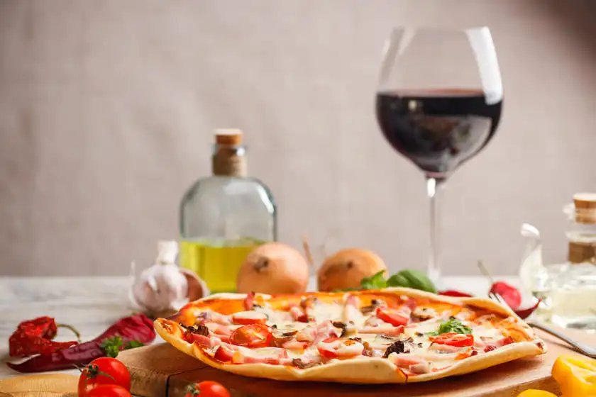 red wine and fresh pizza