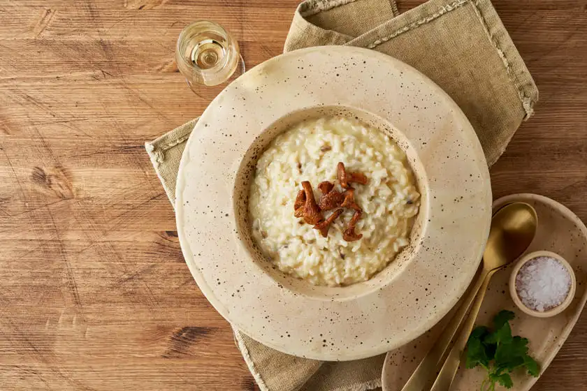 risoto with chanterelle mushrooms in large plate