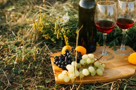 close up of bottle of red wine two glasses