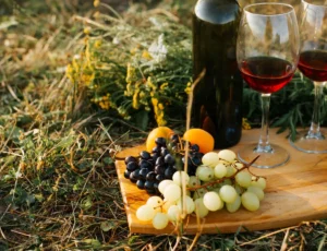 moldova wine - close up of bottle of red wine two glasses grape